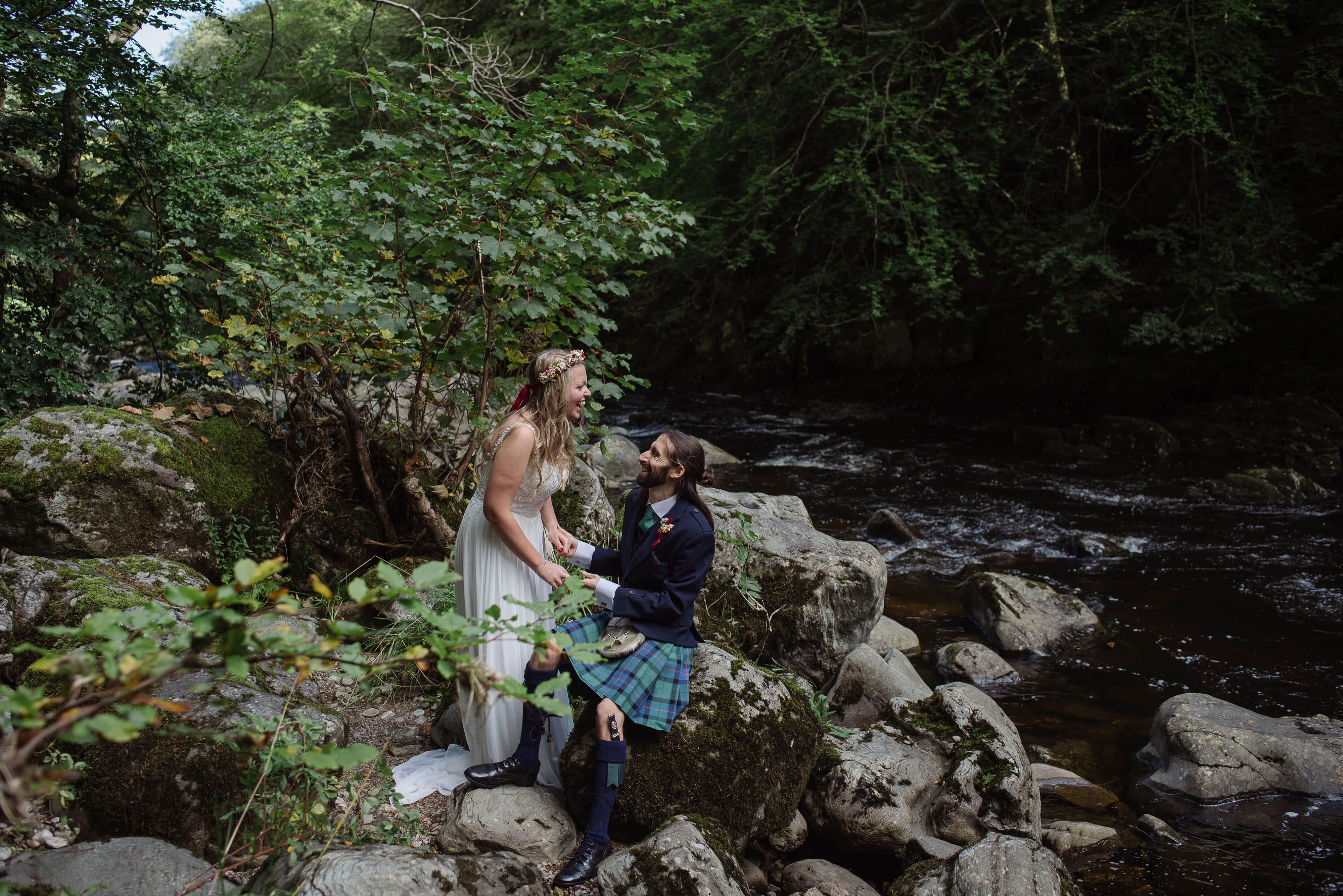 Alternative Wedding Photographer Scotland bride groom scottish wedding portraits on rocks by waterfall