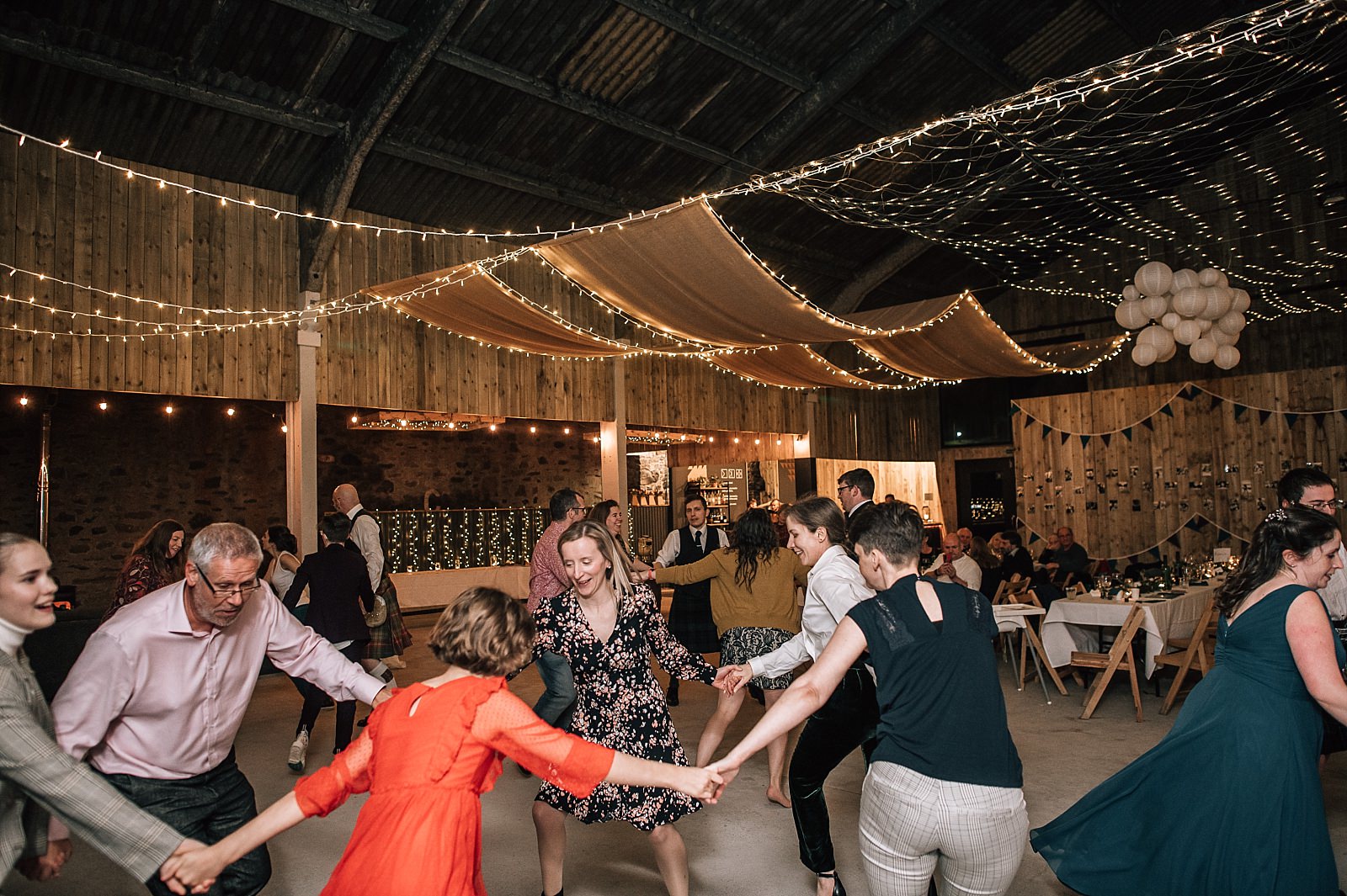 interior of boreland loch tay wedding venue set up for reception dancing ceilidh with fairy lights