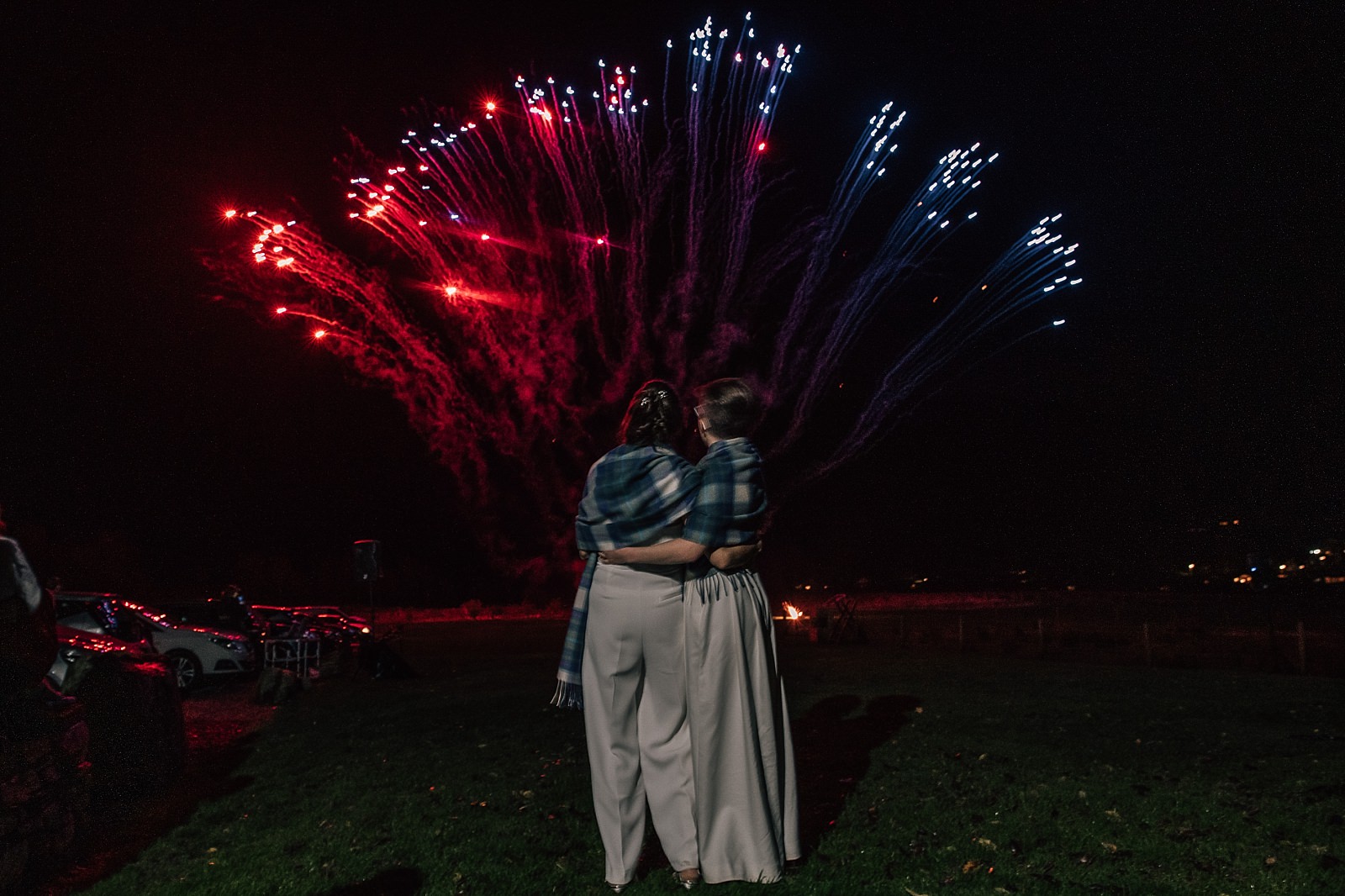 boreland loch tay wedding venue with fireworks display in perthshire scotland with two brides watching the show
