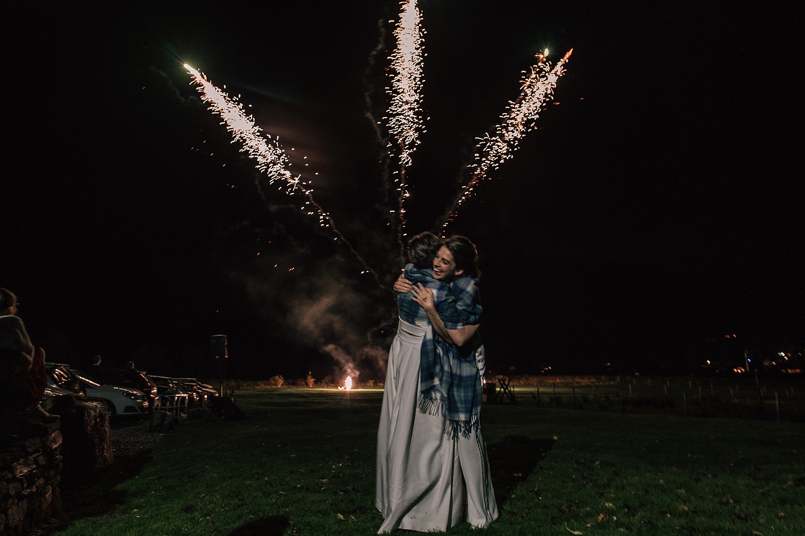 boreland loch tay wedding venue with fireworks display in perthshire scotland with two brides watching the show