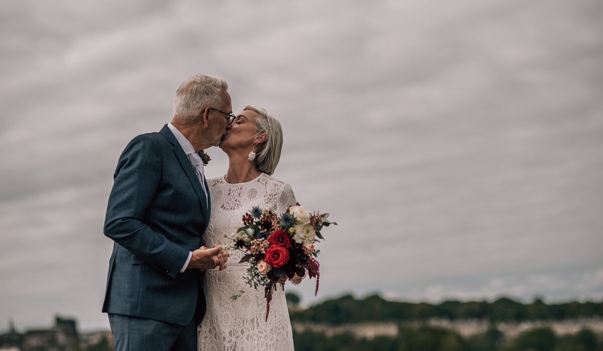 older bride and groom kiss on their wedding day by edinburgh elopement photographer scotland