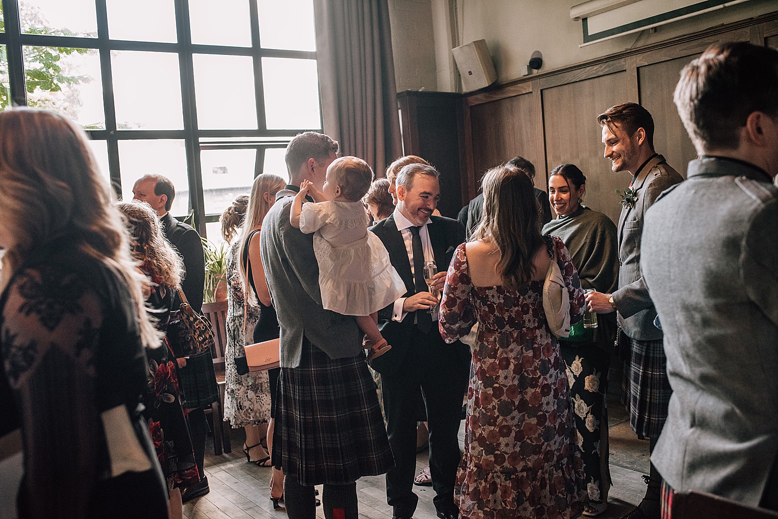 guests gathering during drinks reception at west brewery wedding at west on the green scotland