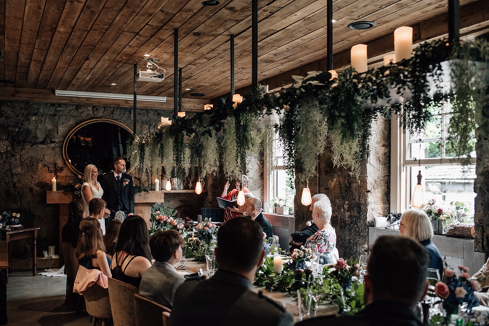 inside the scullery during the bothy glasgow wedding with decorative lighting and foliage chandelier at glasgow west end wedding