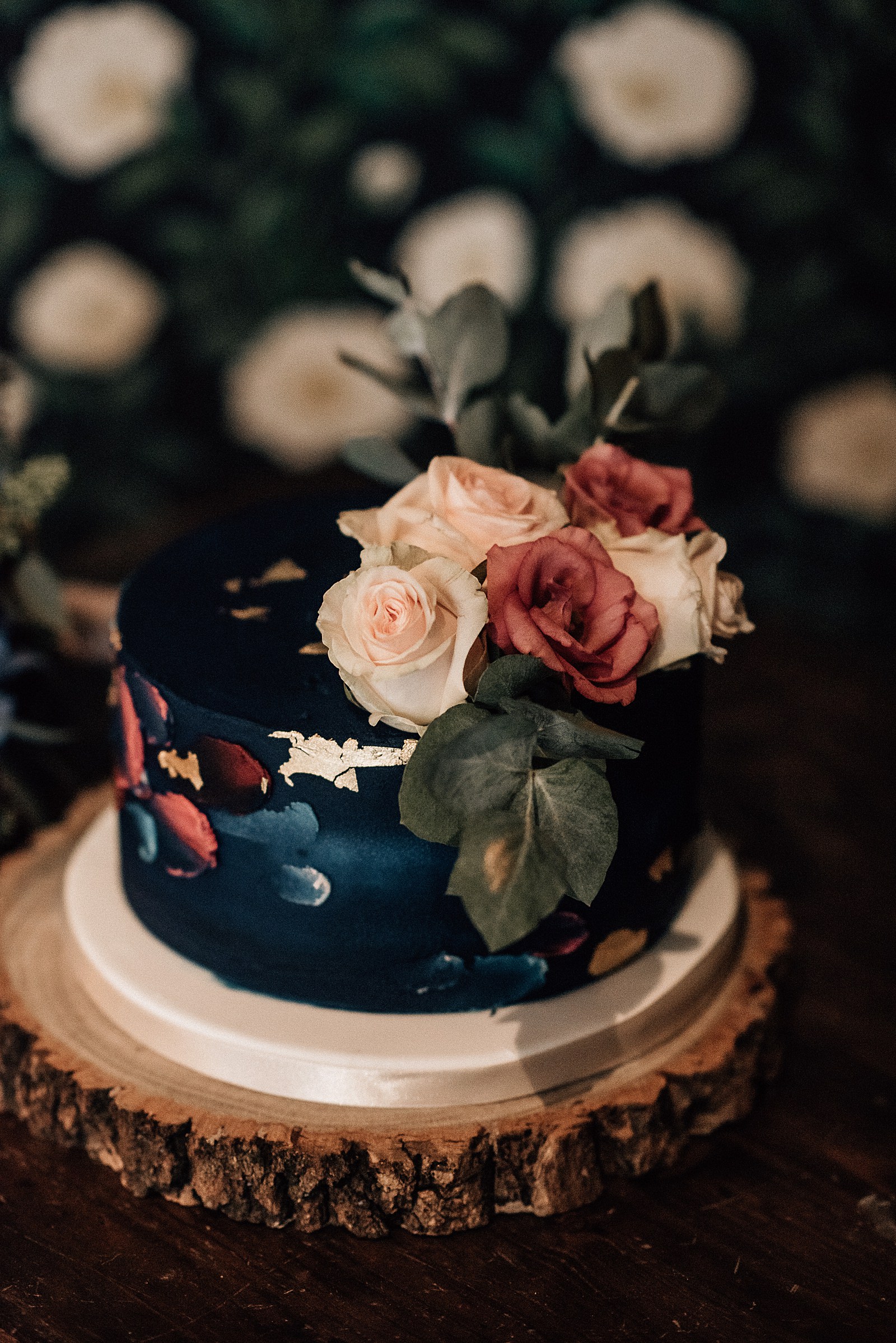 navy blue wedding cake with pink flowers at the bothy glasgow wedding