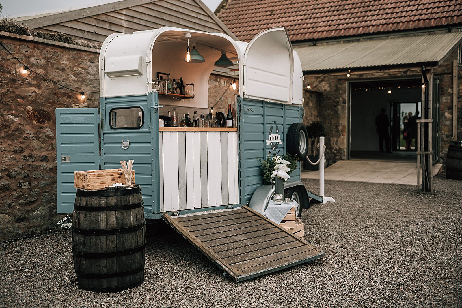 blue mobile bar horse box set up outside the cow shed scotland for wedding reception at quirk Scottish wedding