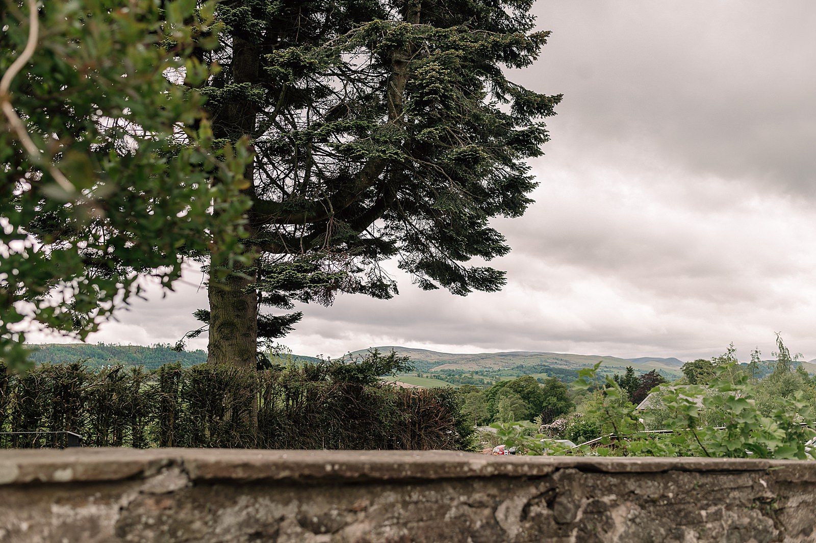 exterior view from comrie croft wedding venue one of the best Scottish barn wedding venues in scotland