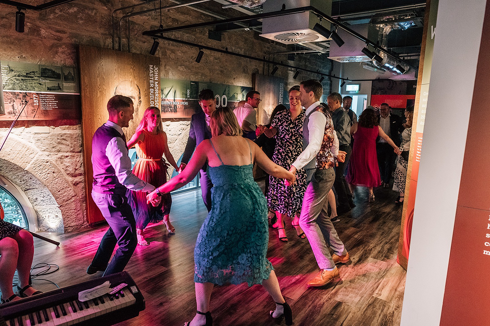 wedding guests ceilidh dancing at clydeside distillery wedding