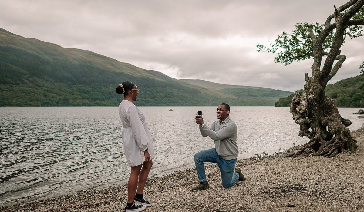 Scottish surprise proposal at firkin point Loch Lomond on the shore captured by proposal photographer scotland