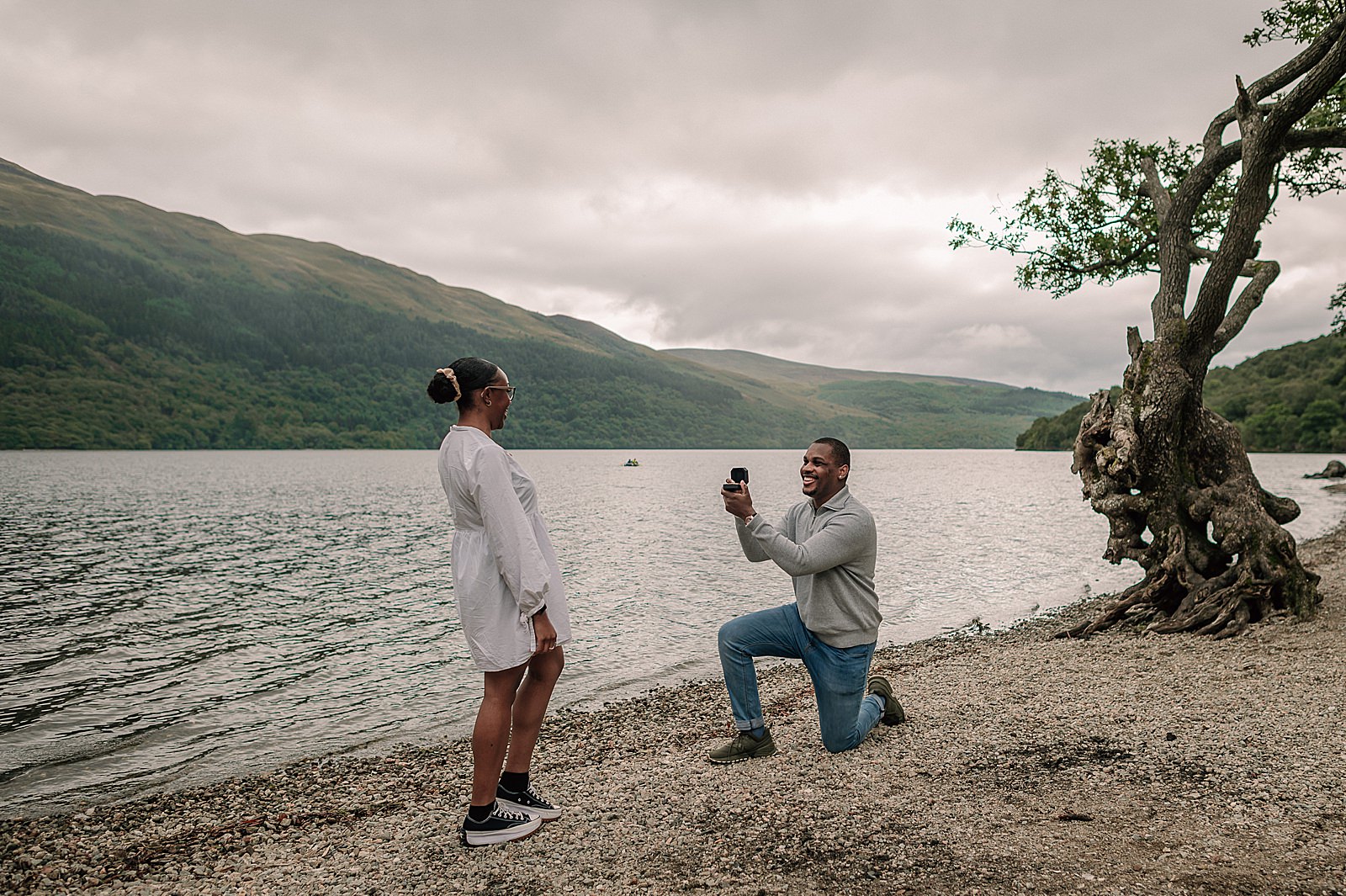 Scottish surprise proposal at firkin point Loch Lomond on the shore captured by proposal photographer scotland