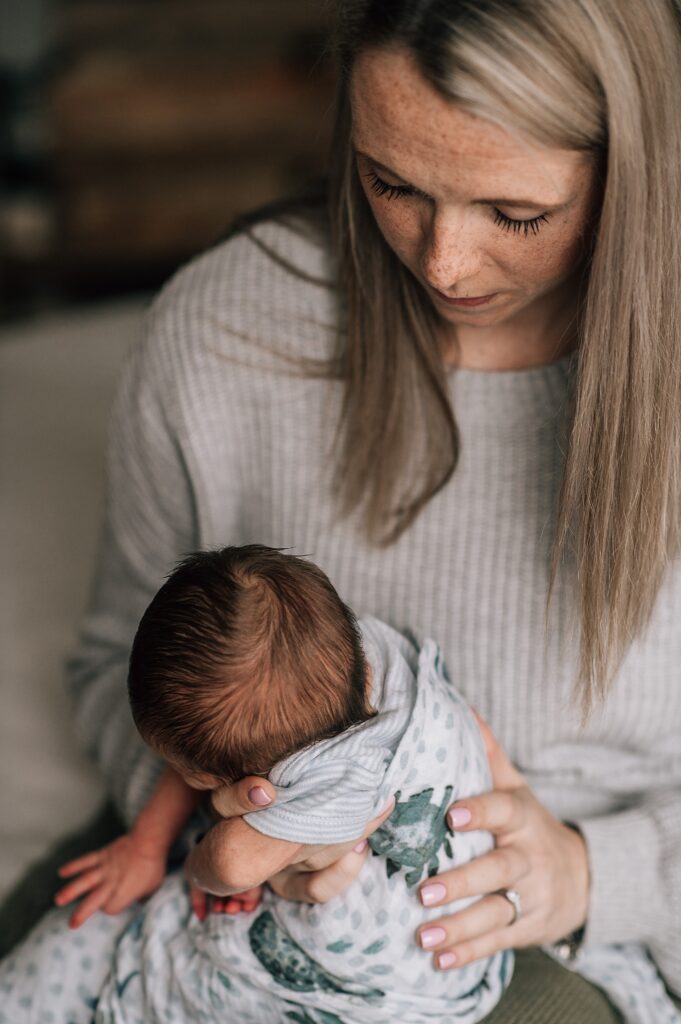 mother patting baby's back