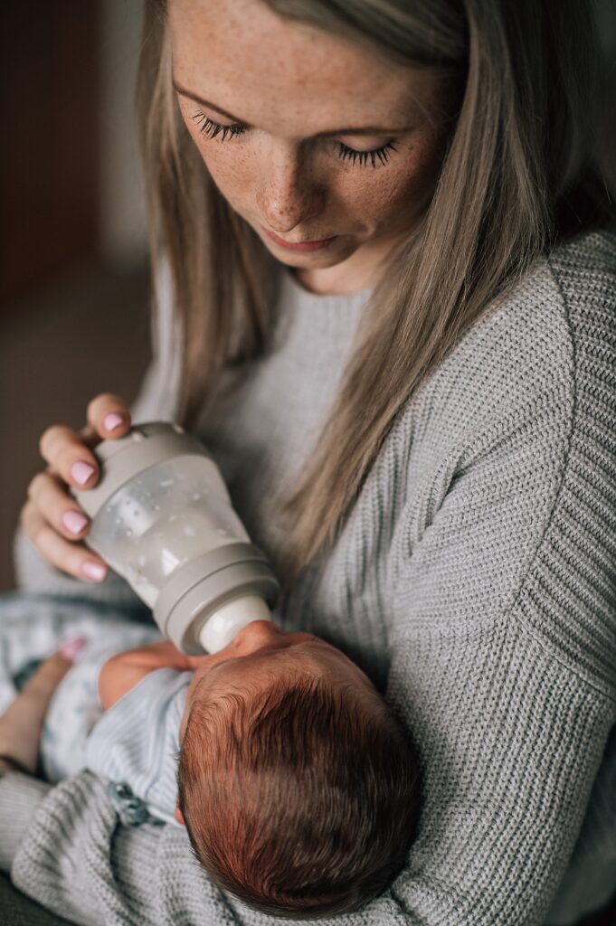 mother feeding newborn baby