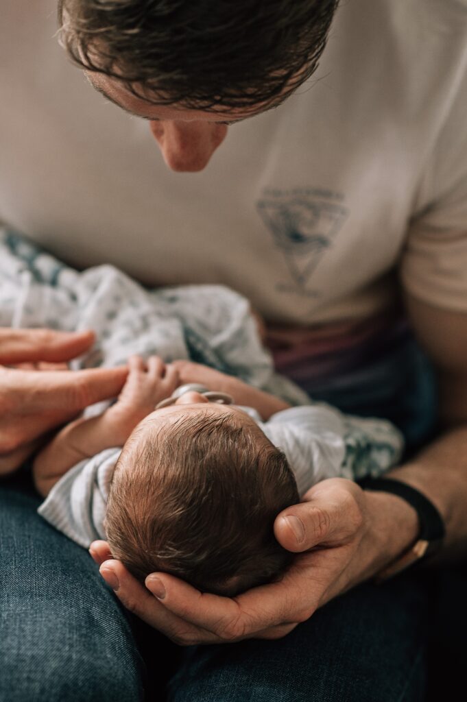 father close to baby's face