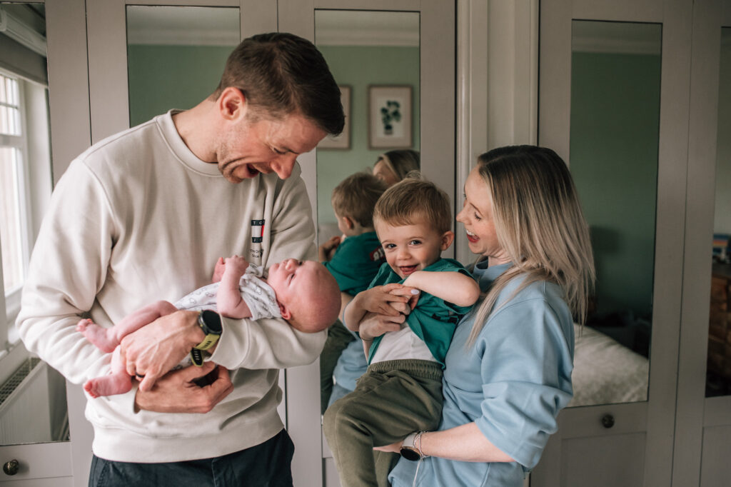 relaxed in home newborn family photography session