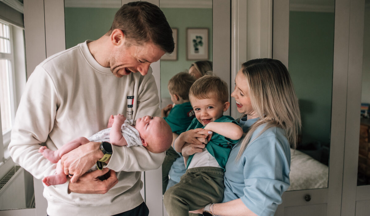 relaxed in home newborn family photography session