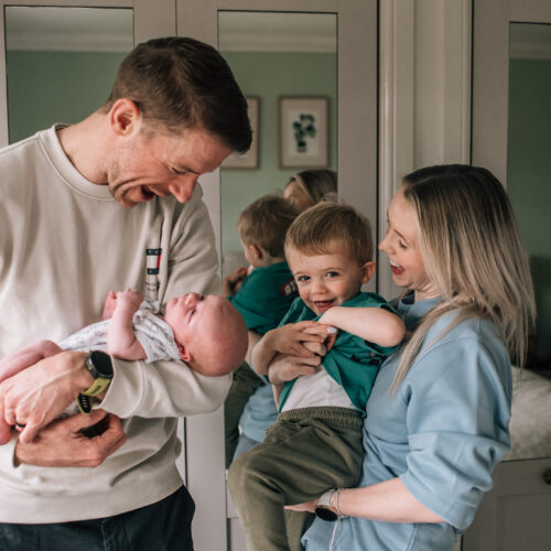 relaxed in home newborn family photography session